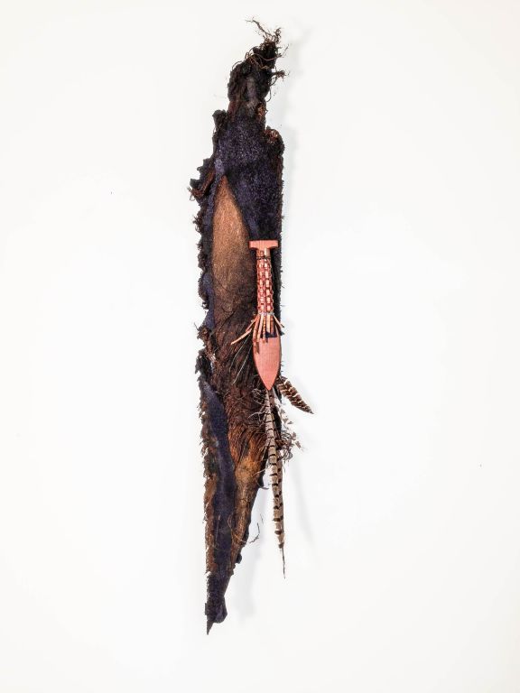 Feathers in her Hair, mixed media: tire-tread, feathers, metal, wood, reeds, H 33" x W 6 1/2" x D 7"